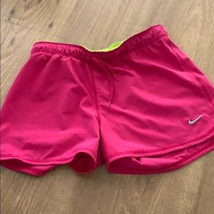 pink NIKE running shorts